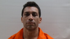 Booking photo of DE LA CRUZ REGINO JR
